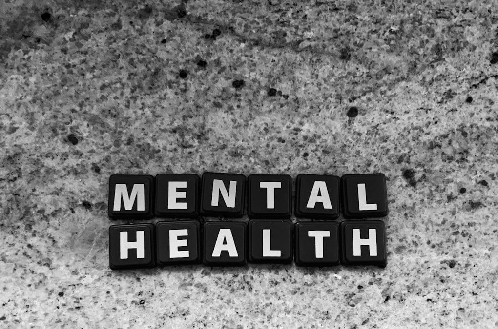 a black and white photo of the word mental health