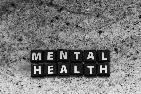 a black and white photo of the word mental health